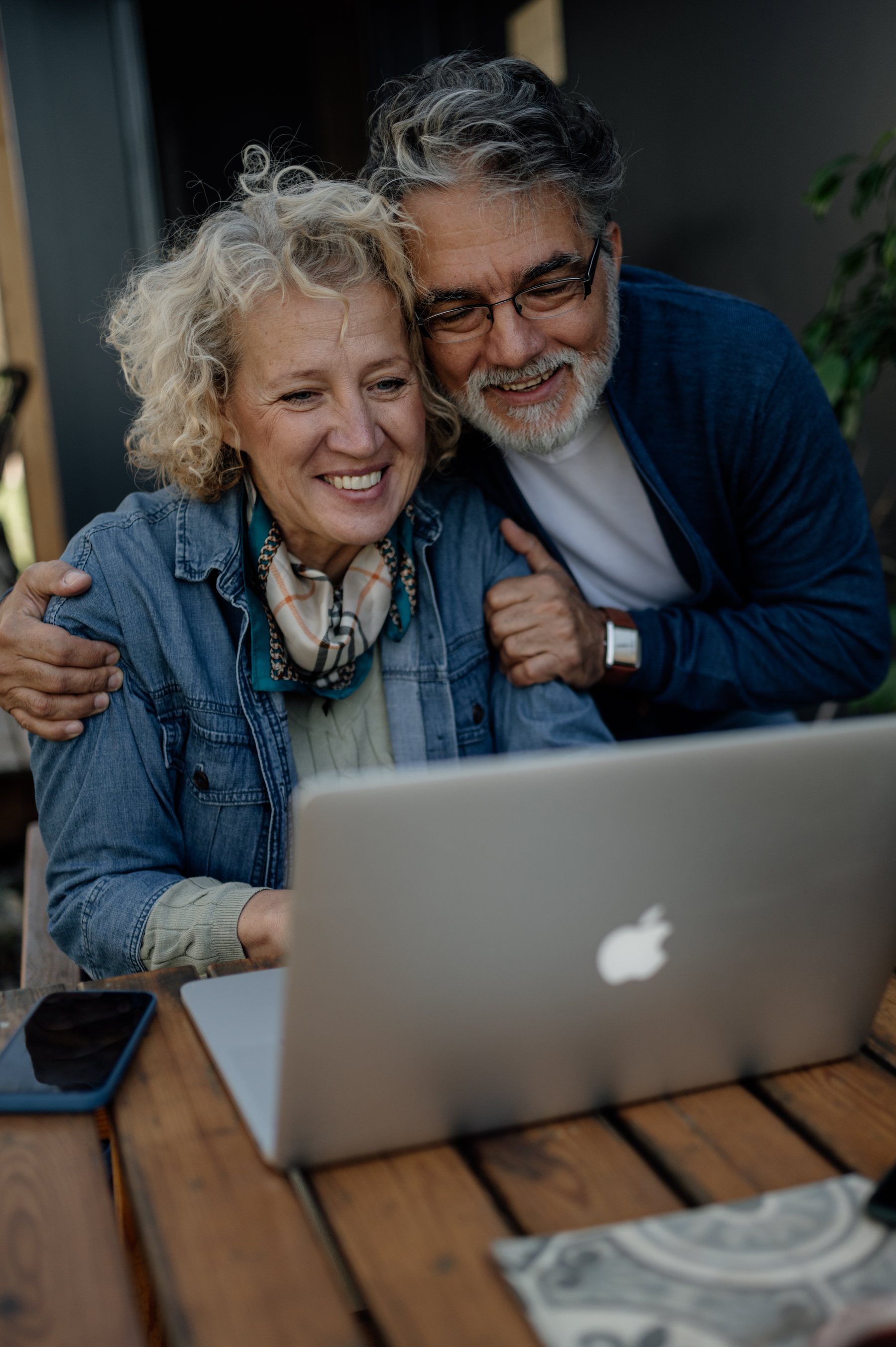 Adult learners using a laptop together
